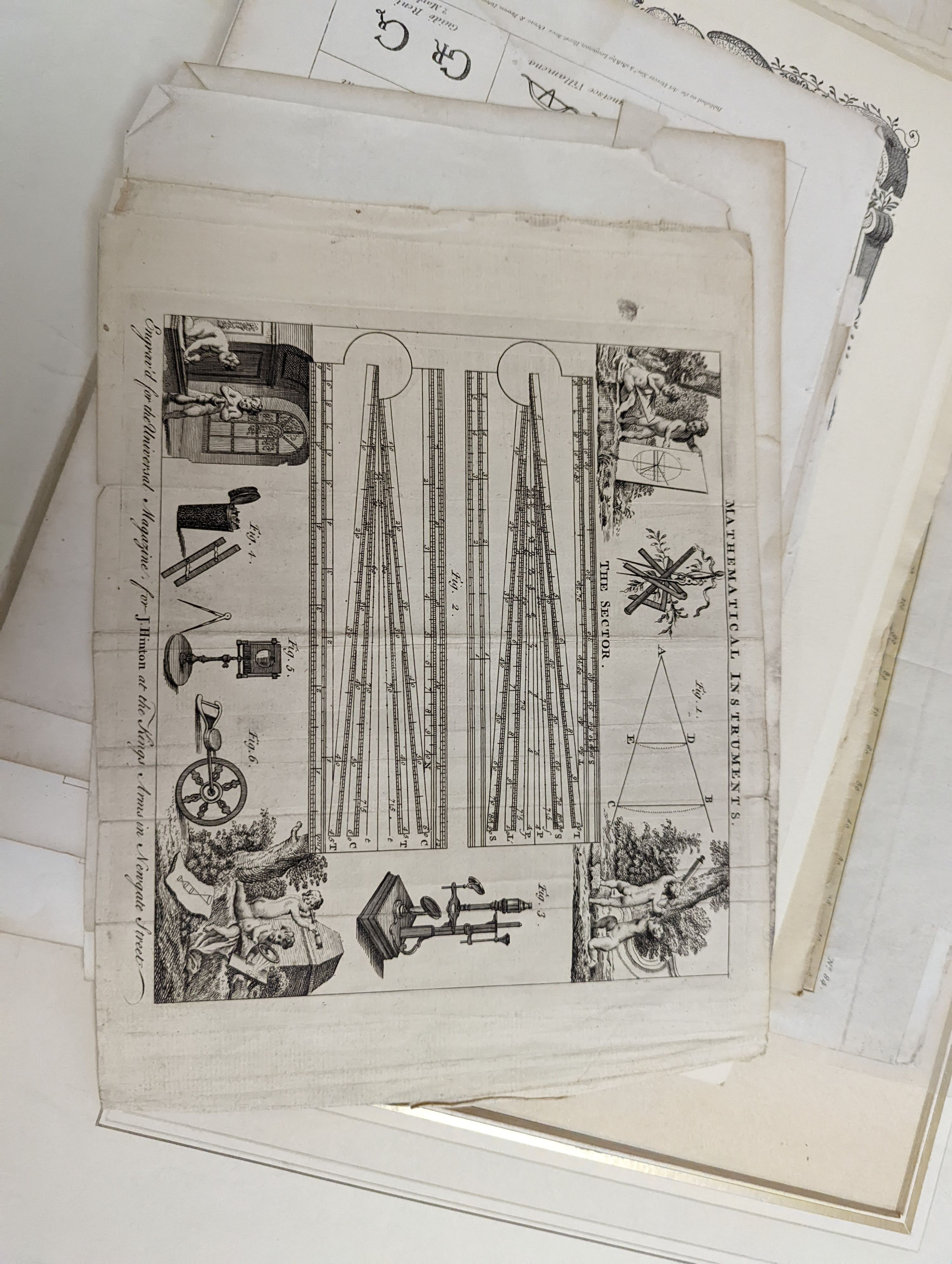 A folio of 18th/19th century maps and scientific engravings, including an engraving after Ludovico Lanberti, a map of the World plotting Bourgainvilles voyage of 1772